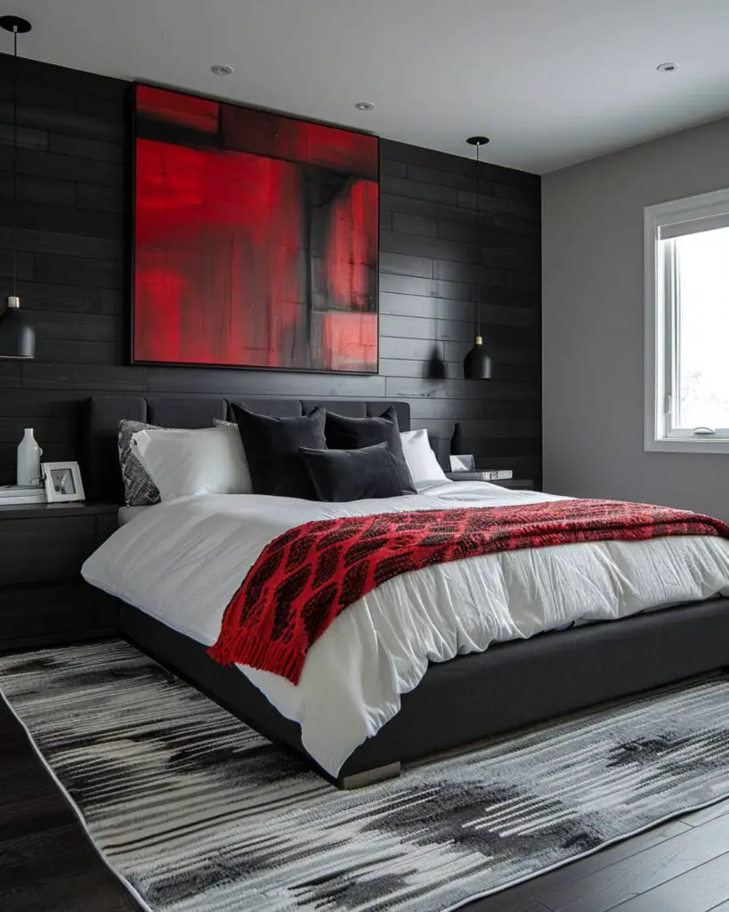 Red bed, black pillows, abstract art, gray rug, black walls