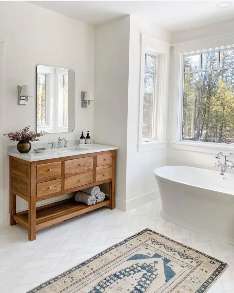 Sunny bathroom with wood vanity and tub