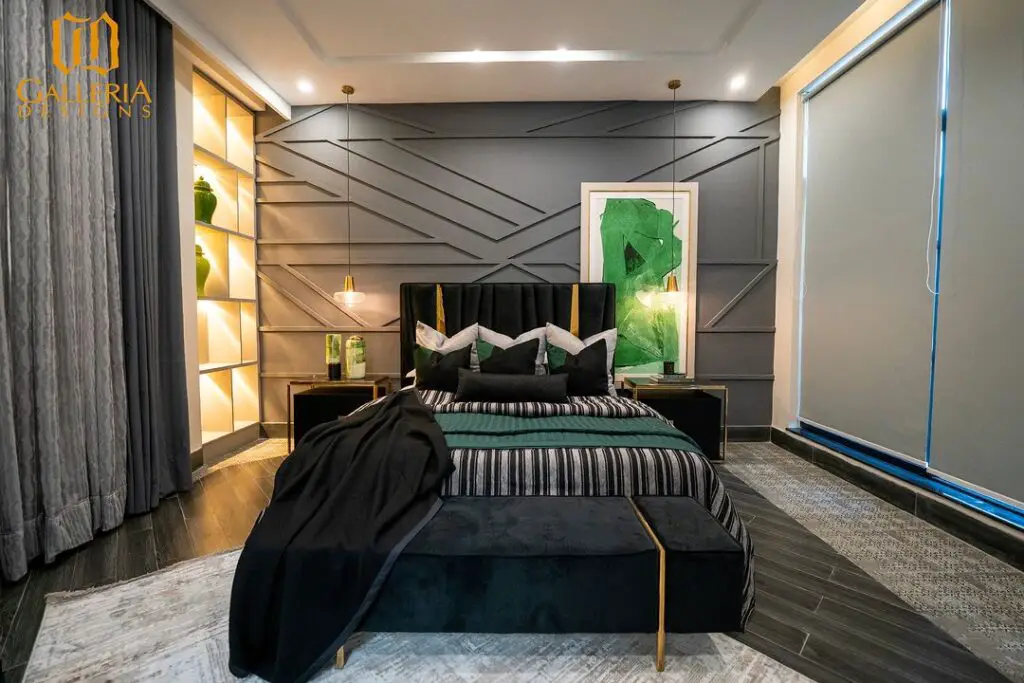 Dark bedroom with emerald green accents