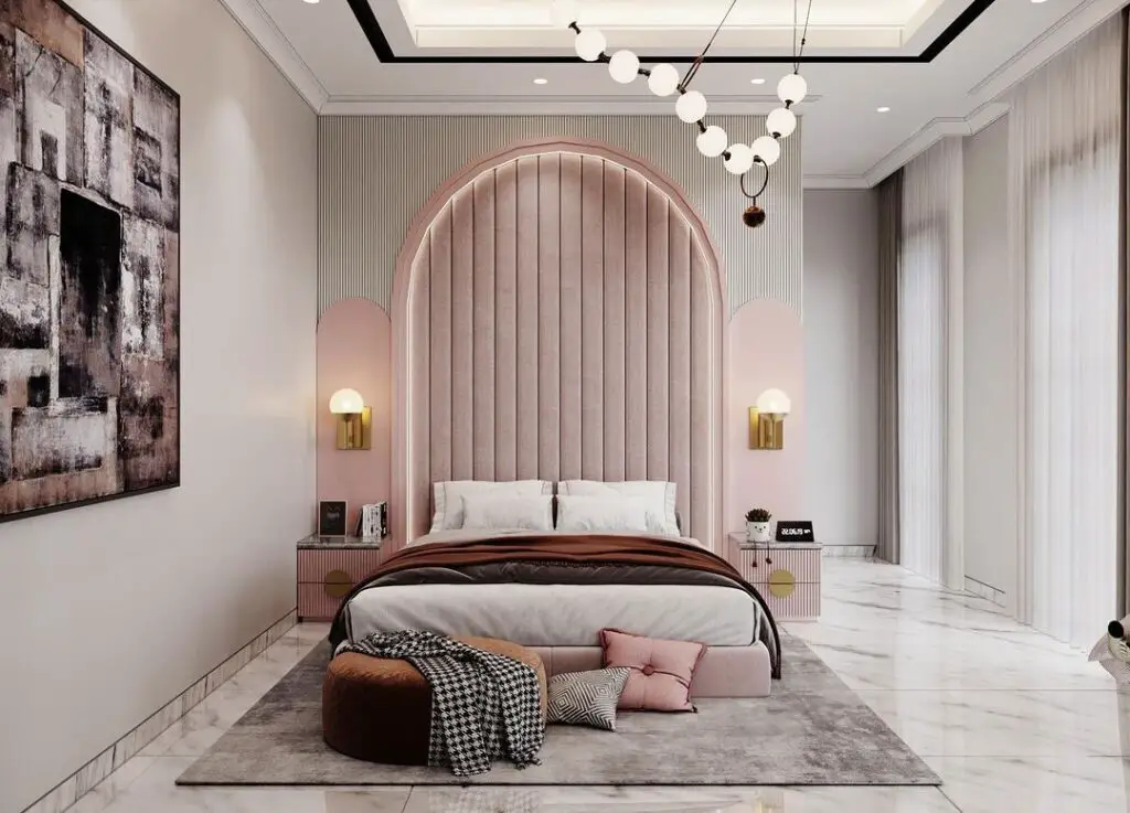 Luxurious bedroom featuring arched pink headboard and modern decor
