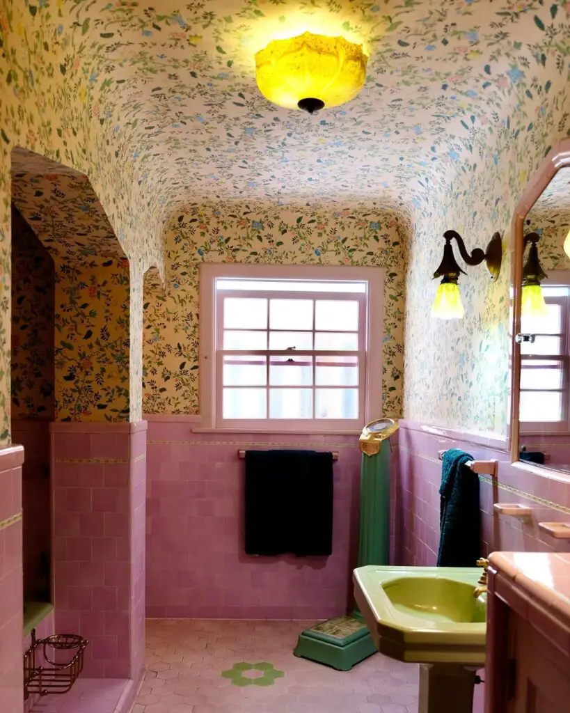 Vintage bathroom with flowery wallpaper pink tiles