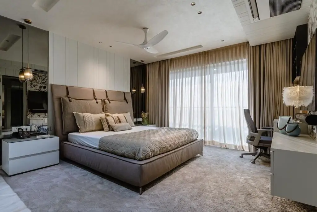 Neutral bedroom with taupe upholstered bed