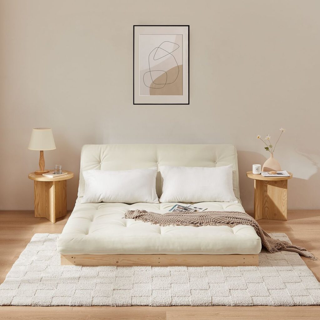 Zen-like bedroom with low futon bed and minimalist decor