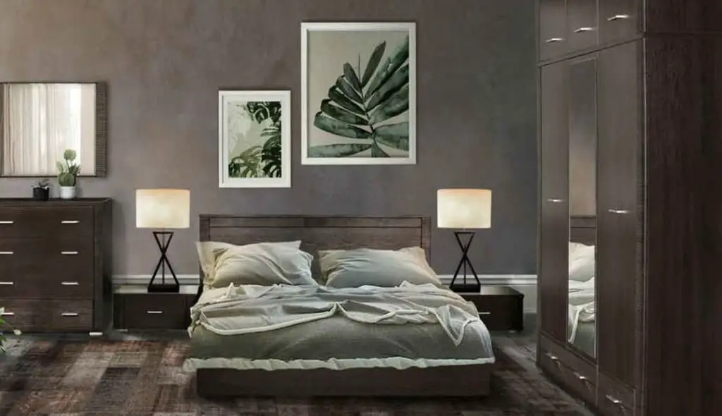 Dark bedroom with green botanical artwork