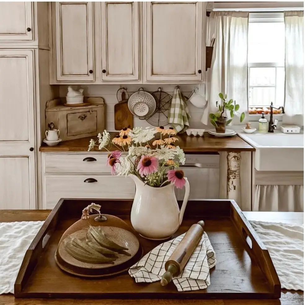 Farmhouse kitchen with floral centerpiece on wooden tray
